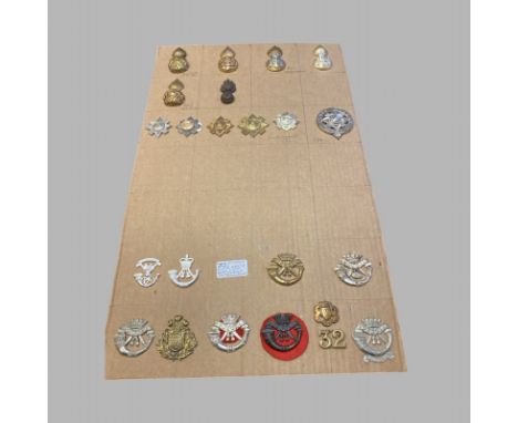 22 Cap Badges Scots Guards, Royal Scots Fusiliers, Royal Highland Fusiliers, Cornwall Light Infantry and Others.  Good Condit