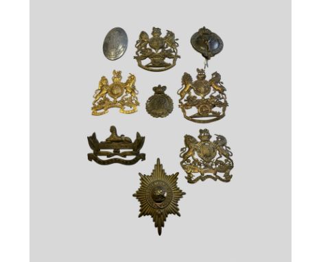 Royal Artillery Plates and Others 2 Royal Artillery Brass Helmet Plates, 1 Adjutant General Corp Helmet Plate, 1 General Serv
