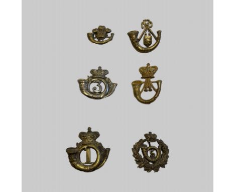6 Assorted Light Infantry Cap Badges? Fixings in tact. Good Condition. Essex? 1st and 3rd with Victorian Crown, plus 2 others