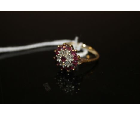 A 9CT GOLD RUBY AND DIAMOND DRESS RING 