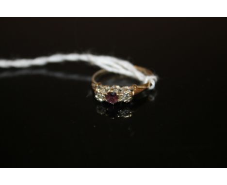 A 9CT GOLD RUBY AND DIAMOND DRESS RING