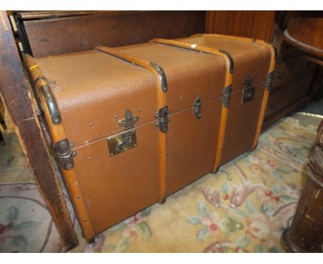 A BANDED VINTAGE TRAVEL TRUNK
