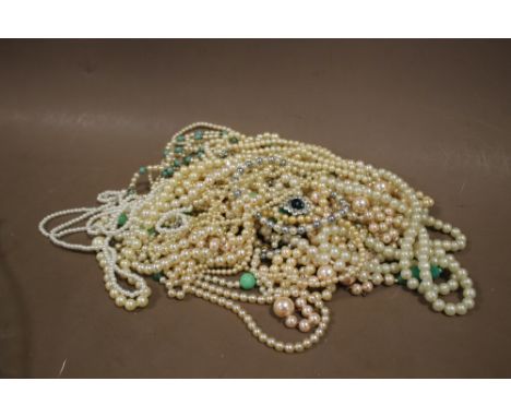 A LARGE QUANTITY OF SIMULATED PEARL NECKLACES