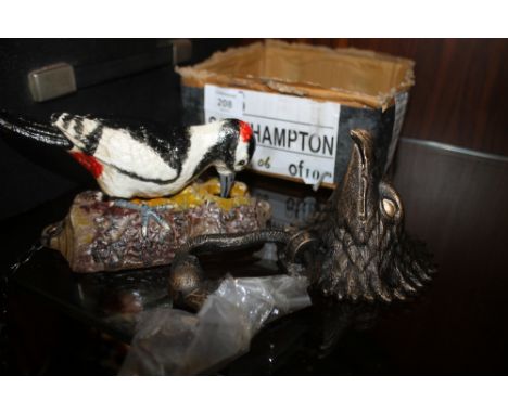 **A CAST METAL DOOR KNOCKER IN THE FORM OF A WOODPECKER TOGETHER WITH AN EAGLE BUST EXAMPLE (2) **