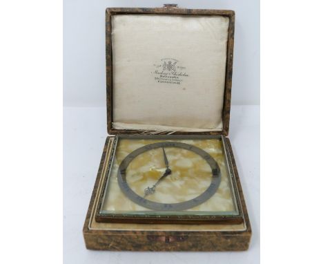 An Art Deco gilded bronze cased desk clock by Mackay &amp; Chisholm. In its original fitted box with pearl effect bakelite fa