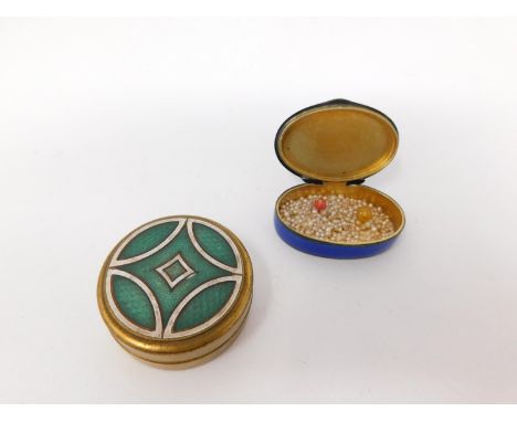 Two enamel boxes. One Continental silver royal blue guilloche enamel pill box with garland and foliate engine turned decorati