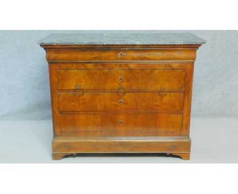 A late 19th century French Louis Philippe burr walnut commode with grey veined marble top and four drawers raised on shaped a