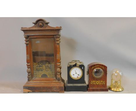 A carved oak wall clock case painted with a gilt design of a hummingbird on a branch, a glass dome brass mantle clock, an ebo