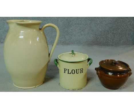 A large 19th century cream stoneware Doulton Lambeth Jug, impressed mark to base along with an antique lidded glazed earthenw