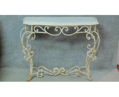 A mid 20th century white painted wrought iron console table with shaped marble top on scrolling cabriole supports. H.87x112cm