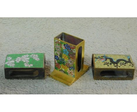 Three vintage Japanese Cloisonné enamel match box covers. One depicting a dragon on a pale yellow background, one a stylised 