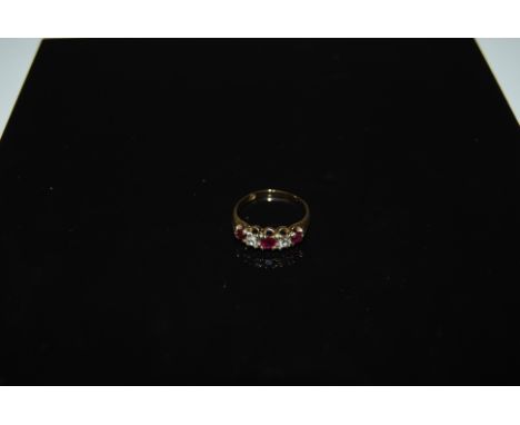 LADIES 18CT YELLOW GOLD RING SET WITH 3 RUBIES, 1 X 4MM & 2 X 2MM DIAMETER, AND 2 DIAMONDS WHICH MEASURE APPROXIMATELY 4MM DI