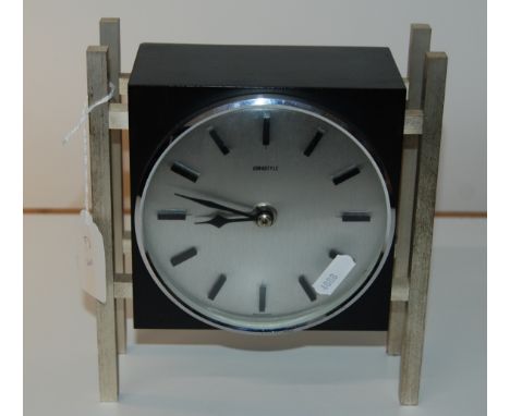 WEST GERMAN CLOCK EURASTYLE IN A BLACK CASE SUPPORTED BY 4 CHROME PLATED SQUARES PILLARS