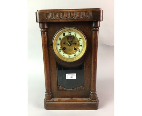 EDWARDIAN MANTEL CLOCK WITH VISIBLE ESCAPEMENT, contained in an oak case