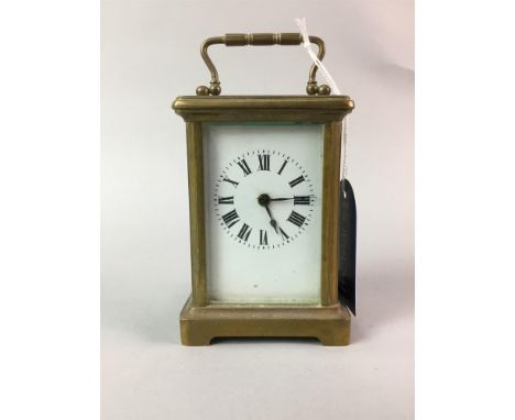 SMALL CARRIAGE CLOCK, in brass and bevelled glass case