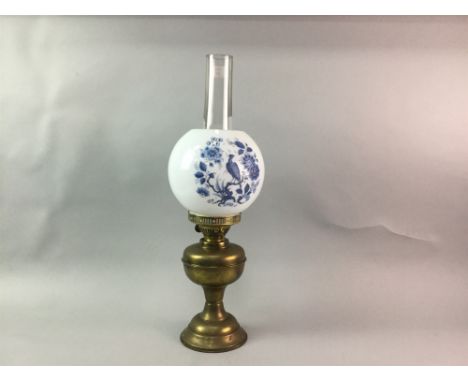 VICTORIAN BRASS OIL LAMP, the white frosted glass shade with blue peacock motif decoration