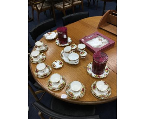 PAIR OF ROYAL ALBERT OLD COUNTRY ROSES CANDLESTICKS, with boxes; along with a matching tea service and cake stand