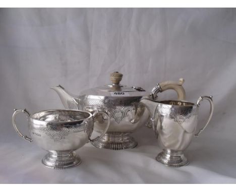 GOOD QUALITY THREE PIECE GEORGIAN STYLE  TEA SERVICE with circular bodies engraved with shell   motifs and scrolls. Teapot wi