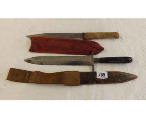 Dagger in leather sheath      