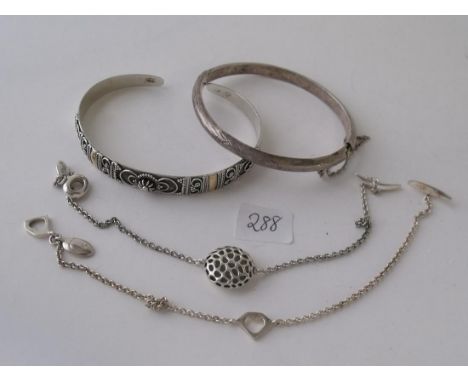 Four silver bangle/bracelets      