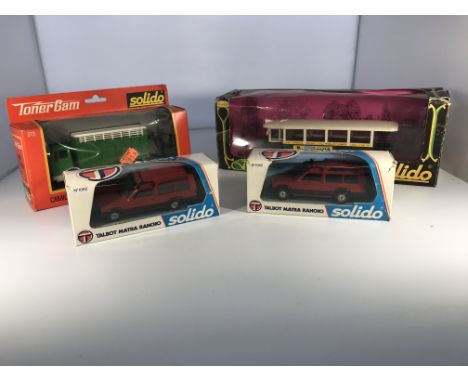 Four Solido model vehicles. A cattle truck #373, a 'Banania' Renault bus #4401 &amp; two Talbot Matra Rancho 4x4s #1062 - NO 