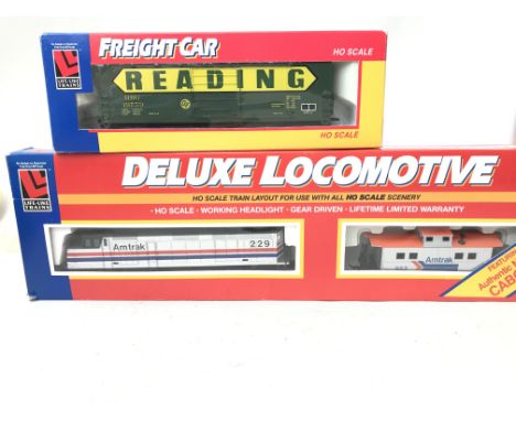 A Boxed American Life-Like Trains H0 Scale Deluxe Locomotive with Freight Car Boxed.