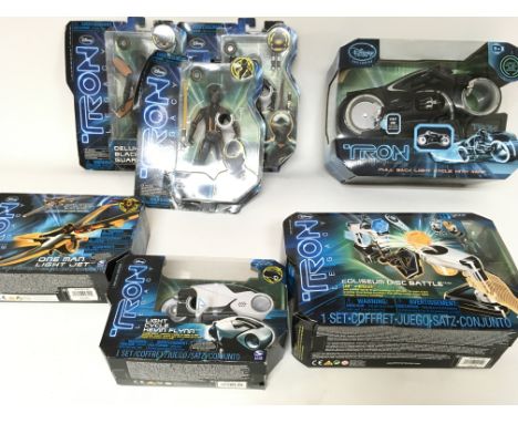 Collection of various Tron legacy toys. Including carded figures and Light cycles.