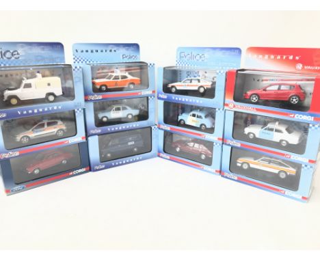 A Collection of Vangurads Police Vehicles and A Vauxhall. All boxed.