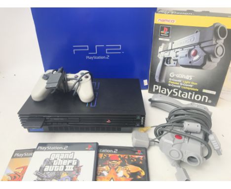 A Boxed PlayStation 2 With Games and a Light gun.(2).