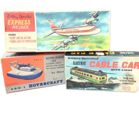 3 x Boxed vintage Battery Operated vehicles including a Cosmo Cable Car. A Marx Hovercraft and Express Airliner.(2)