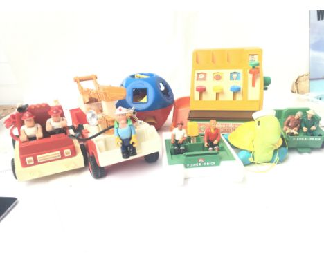 A collection of fisher price toys including a 1970 cash register. A Tupperware shape sorter (1970). A 1976 patrol boat all te