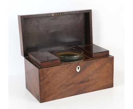 19th century mahogany tea caddy, of rectangular form, the hinged top with loop handle enclosing two caddies and associated gl