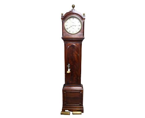 An Early 19th century eight-day mahogany longcase clock, the fret carved hood with brass ball finials and convex glass enclos