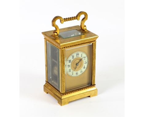 Brass and four glass carriage clock with lever movement, the chapter ring with Arabic numerals, striking on a gong, 19cm high