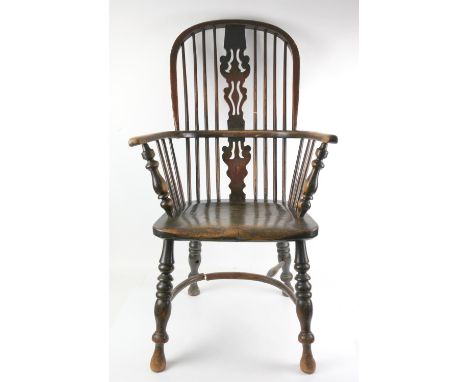 Ash and elm Windsor armchair with high back, vase shape fret carved splat, moulded seat and turned legs joined by a crinoline