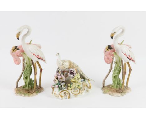 Pair of Goebel porcelain Flamingo's, impressed No 38163  23, 23cm high, and a English porcelain peacock with flower encrusted