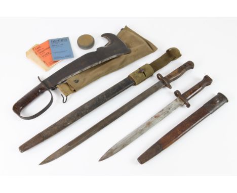 WWII period LC-14-B Woodman's Pal survival axe with original canvas scabbard, containing sharpening stone, and two booklets, 