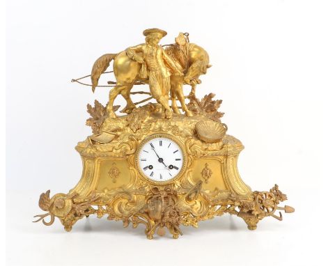 19th century French gilt metal mantel clock mounted with a figure of a boy and a horse over a scrolling base depicting farm i