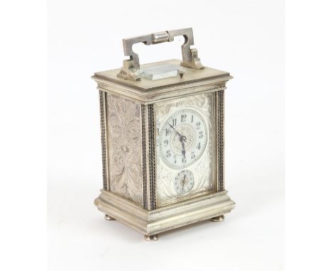 Repeating Carriage clock striking on a gong with alarm movement,  in white metal case heavily chased with foliate decoration,