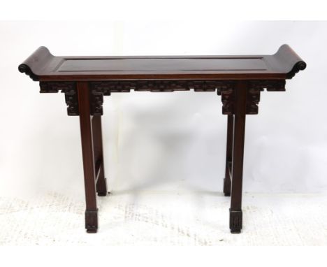 A Chinese hardwood altar table, with scroll ends over square scroll carved frieze and square legs on block feet, H85 W126 D37