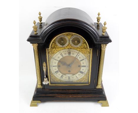 19th century ebonised bracket clock by Dent, 61 Strand, London, the domed case with brass finials and pilasters enclosing a b