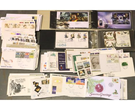 Selection of first day covers in a box and two albums. P&amp;P Group 2 (£18+VAT for the first lot and £3+VAT for subsequent l