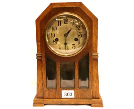 Oak cased mantel clock with key and pendulum, works for five minutes and stops, H: 37 cm. Not available for in-house P&amp;P,