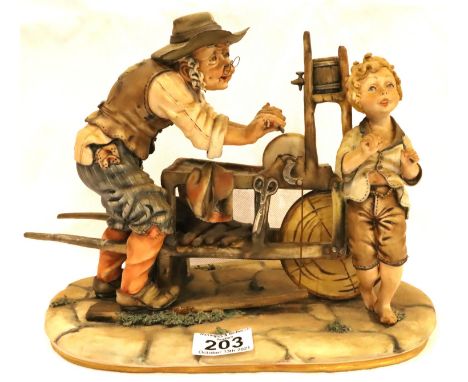 Capodimonte figurine The Knife Grinder by Melio, H: 21 cm. P&amp;P Group 3 (£25+VAT for the first lot and £5+VAT for subseque