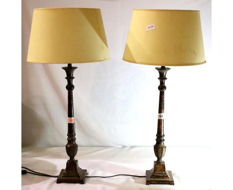 Pair of cast metal table lamps of monumental form with cream shades, overall H:75 cm. Not available for in-house P&amp;P, con