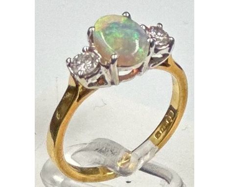 An opal and diamond ring, approximate size K, opal approximately 8mm long.