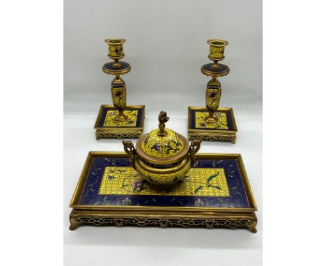 A French "Chinese" Famille Jaune gilt brass and champleve enamel desk set comprising of an ink well and stand and two candle 