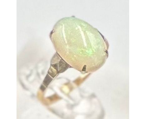 A 9ct gold ring with opal central stone, approximate size K.