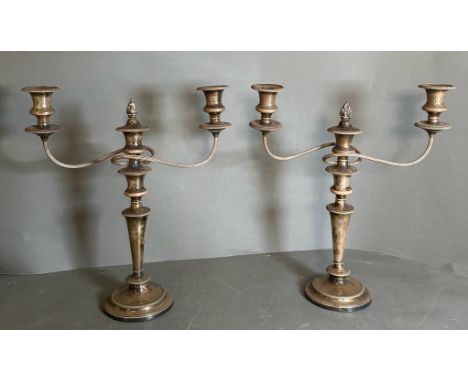 A pair of Garrard & Co three light silverplated candlesticks.