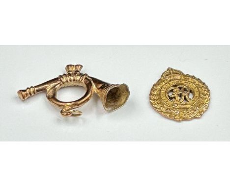 A 9ct gold charm in the form of a bugle and a Royal Engineers medallion, approximate total weight 4.2g
